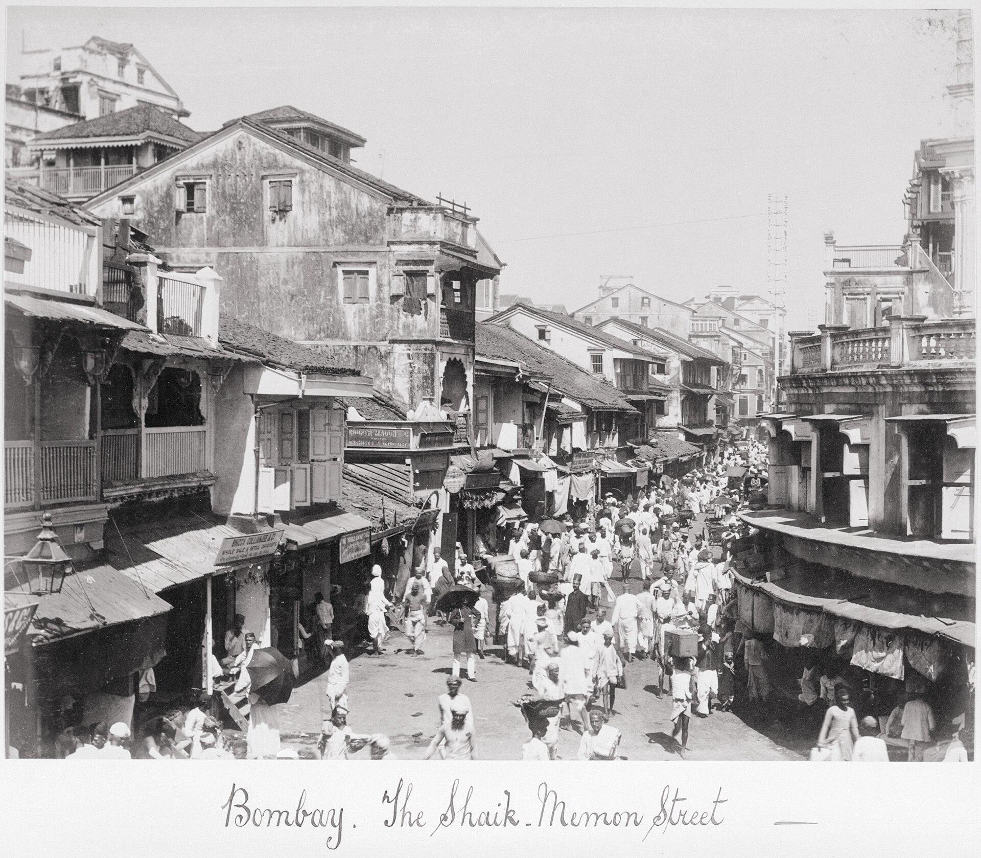 Shaik Memon Street, Bombay, late 1860s. Samuel Bourne. LACMA dates the albumen print to the late 1860s.. Street photograph.